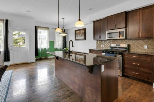305-413 River Avenue, Cochrane, AB - Indoor Photo Showing Kitchen With Upgraded Kitchen
