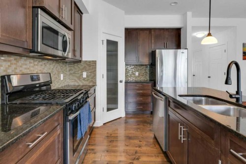 305-413 River Avenue, Cochrane, AB - Indoor Photo Showing Kitchen With Double Sink With Upgraded Kitchen