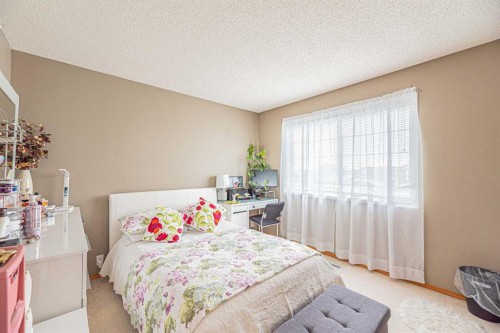 18 Coral Springs Circle Ne, Calgary, AB - Indoor Photo Showing Bedroom