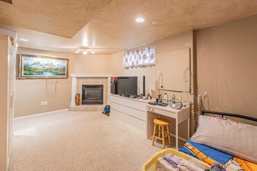 18 Coral Springs Circle Ne, Calgary, AB - Indoor With Fireplace