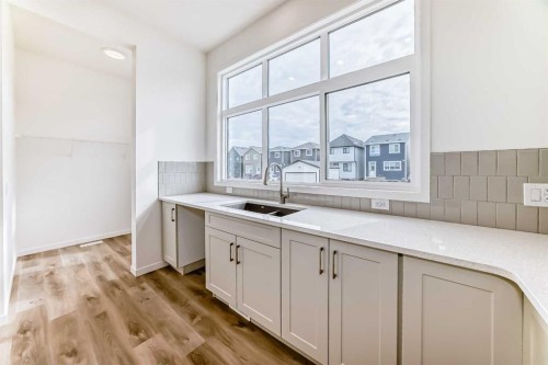 36 Mercado Road Se, Calgary, AB - Indoor Photo Showing Kitchen With Double Sink