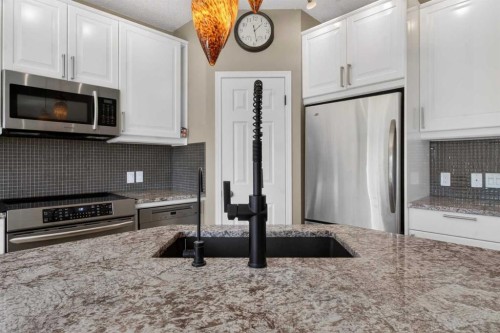 20 Riverwood Crescent Se, Calgary, AB - Indoor Photo Showing Kitchen With Stainless Steel Kitchen With Double Sink With Upgraded Kitchen