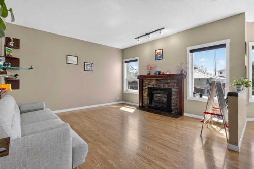 20 Riverwood Crescent Se, Calgary, AB - Indoor Photo Showing Living Room With Fireplace