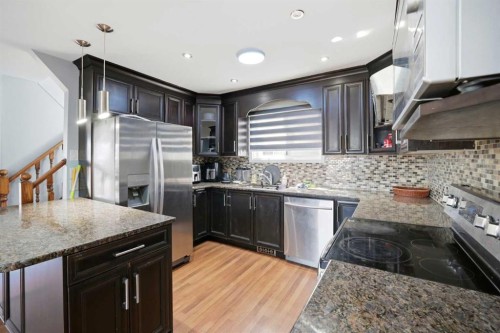 65 Falmere Way Ne, Calgary, AB - Indoor Photo Showing Kitchen With Double Sink With Upgraded Kitchen