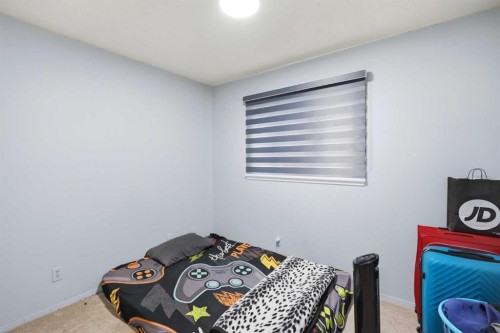 65 Falmere Way Ne, Calgary, AB - Indoor Photo Showing Bedroom