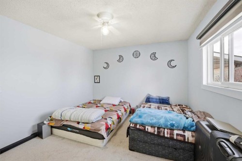 65 Falmere Way Ne, Calgary, AB - Indoor Photo Showing Bedroom