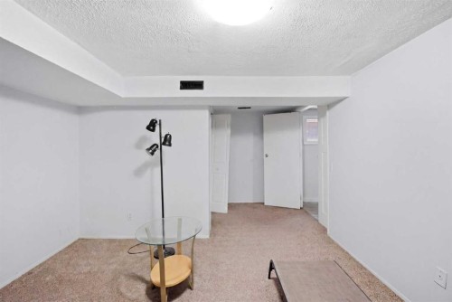 65 Falmere Way Ne, Calgary, AB - Indoor Photo Showing Other Room