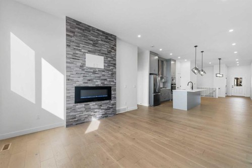 19 Wolf Crescent, Okotoks, AB - Indoor Photo Showing Living Room With Fireplace
