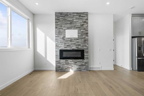 19 Wolf Crescent, Okotoks, AB - Indoor Photo Showing Living Room With Fireplace