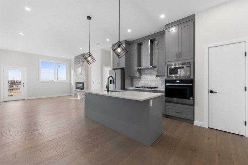 19 Wolf Crescent, Okotoks, AB - Indoor Photo Showing Kitchen With Upgraded Kitchen