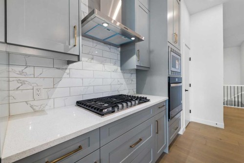 19 Wolf Crescent, Okotoks, AB - Indoor Photo Showing Kitchen With Upgraded Kitchen