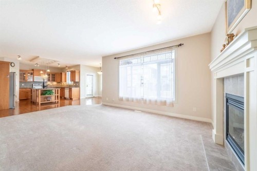 107 Panatella Close Nw, Calgary, AB - Indoor With Fireplace