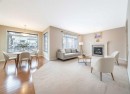 107 Panatella Close Nw, Calgary, AB  - Indoor Photo Showing Living Room With Fireplace 