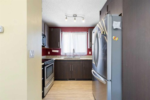 21 Mckernan Road Se, Calgary, AB - Indoor Photo Showing Kitchen