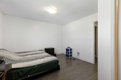 21 Mckernan Road Se, Calgary, AB - Indoor Photo Showing Bedroom