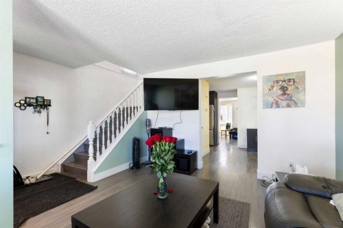 21 Mckernan Road Se, Calgary, AB - Indoor Photo Showing Living Room