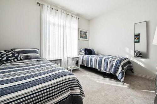 56 Discovery Woods Villas Sw, Calgary, AB - Indoor Photo Showing Bedroom