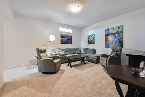 56 Discovery Woods Villas Sw, Calgary, AB - Indoor Photo Showing Living Room