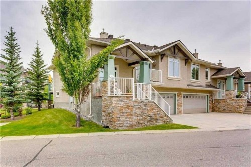 56 Discovery Woods Villas Sw, Calgary, AB - Outdoor With Facade