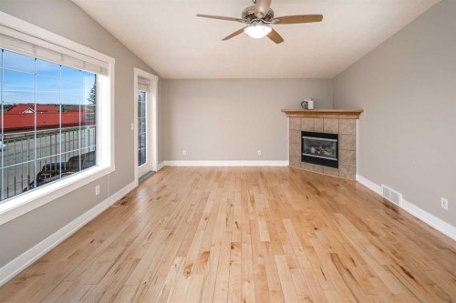 10514 Rockyledge Street Nw, Calgary, AB - Indoor Photo Showing Other Room With Fireplace