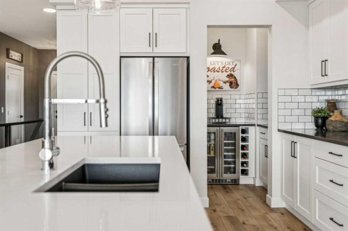 220 Precedence View, Cochrane, AB - Indoor Photo Showing Kitchen With Upgraded Kitchen