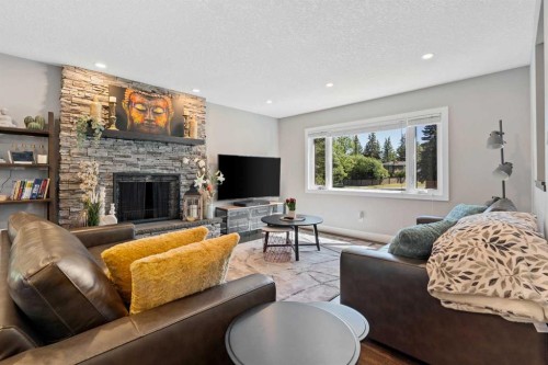 3912 40 Avenue Nw, Calgary, AB - Indoor Photo Showing Living Room With Fireplace