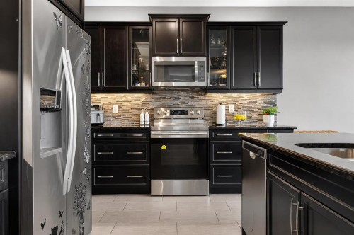 129 Windford Park Sw, Airdrie, AB - Indoor Photo Showing Kitchen With Upgraded Kitchen