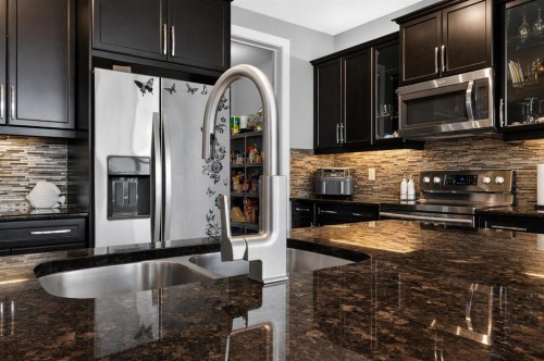 129 Windford Park Sw, Airdrie, AB - Indoor Photo Showing Kitchen With Double Sink With Upgraded Kitchen