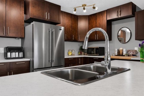 129 Windford Park Sw, Airdrie, AB - Indoor Photo Showing Kitchen With Double Sink