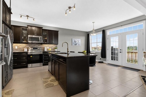 129 Windford Park Sw, Airdrie, AB - Indoor Photo Showing Kitchen With Upgraded Kitchen