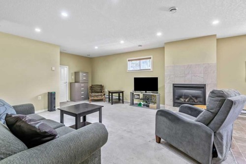 815 3 Street Sw, High River, AB - Indoor With Fireplace