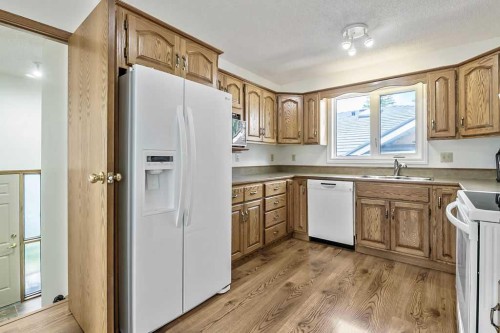 815 3 Street Sw, High River, AB - Indoor Photo Showing Kitchen With Double Sink