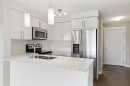 7410-302 Skyview Ranch Drive Ne, Calgary, AB  - Indoor Photo Showing Kitchen With Stainless Steel Kitchen With Double Sink With Upgraded Kitchen 