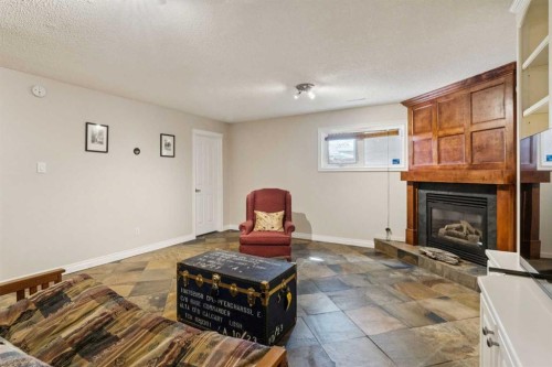 1043 32 Avenue Nw, Calgary, AB - Indoor Photo Showing Living Room With Fireplace