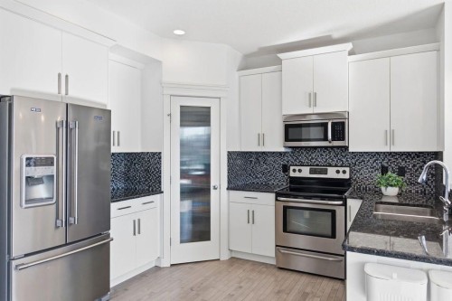 11 Evanscrest Way Nw, Calgary, AB - Indoor Photo Showing Kitchen With Stainless Steel Kitchen With Upgraded Kitchen