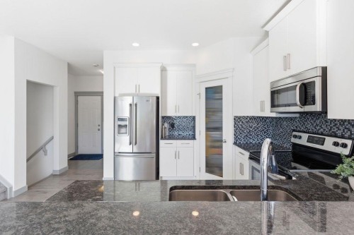 11 Evanscrest Way Nw, Calgary, AB - Indoor Photo Showing Kitchen With Stainless Steel Kitchen With Double Sink With Upgraded Kitchen