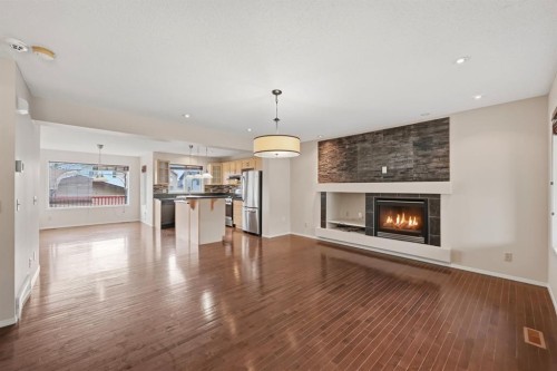 646 Everridge Drive Sw, Calgary, AB - Indoor Photo Showing Living Room With Fireplace