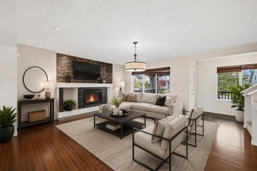 646 Everridge Drive Sw, Calgary, AB - Indoor Photo Showing Living Room With Fireplace