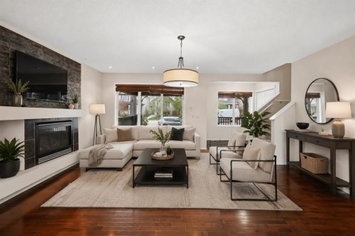 646 Everridge Drive Sw, Calgary, AB - Indoor Photo Showing Living Room With Fireplace