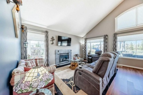 255 Copperfield Manor Se, Calgary, AB - Indoor Photo Showing Living Room With Fireplace