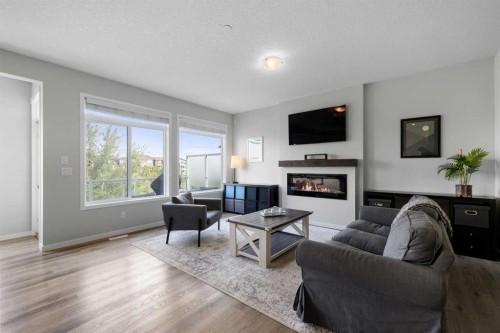 223 Howse Drive Ne, Calgary, AB - Indoor Photo Showing Living Room With Fireplace