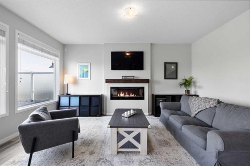 223 Howse Drive Ne, Calgary, AB - Indoor Photo Showing Living Room With Fireplace