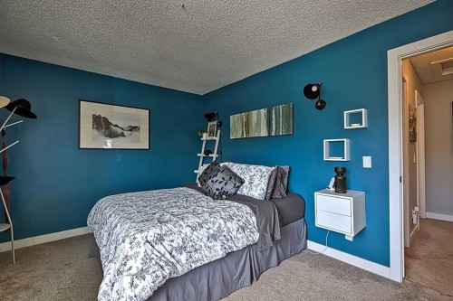 72 Deerpoint Road Se, Calgary, AB - Indoor Photo Showing Bedroom