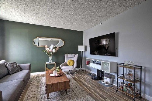 72 Deerpoint Road Se, Calgary, AB - Indoor Photo Showing Living Room
