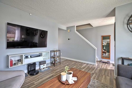 72 Deerpoint Road Se, Calgary, AB - Indoor Photo Showing Living Room