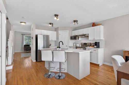 57 Bridlewood Manor Sw, Calgary, AB - Indoor Photo Showing Kitchen With Upgraded Kitchen