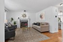57 Bridlewood Manor Sw, Calgary, AB  - Indoor Photo Showing Living Room With Fireplace 