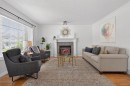 57 Bridlewood Manor Sw, Calgary, AB  - Indoor Photo Showing Living Room With Fireplace 