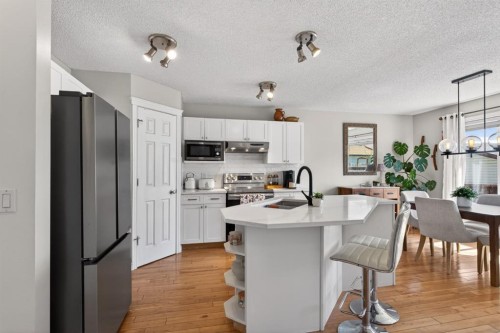 57 Bridlewood Manor Sw, Calgary, AB - Indoor Photo Showing Kitchen With Upgraded Kitchen