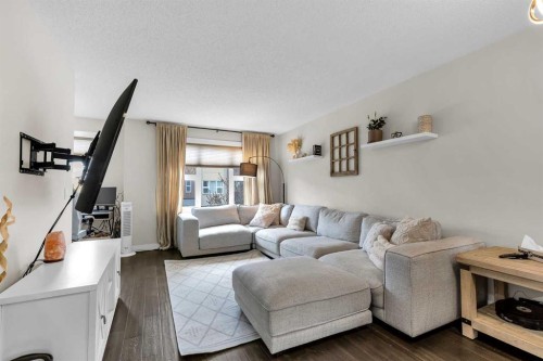 305-2461 Baysprings Link Sw, Airdrie, AB - Indoor Photo Showing Living Room